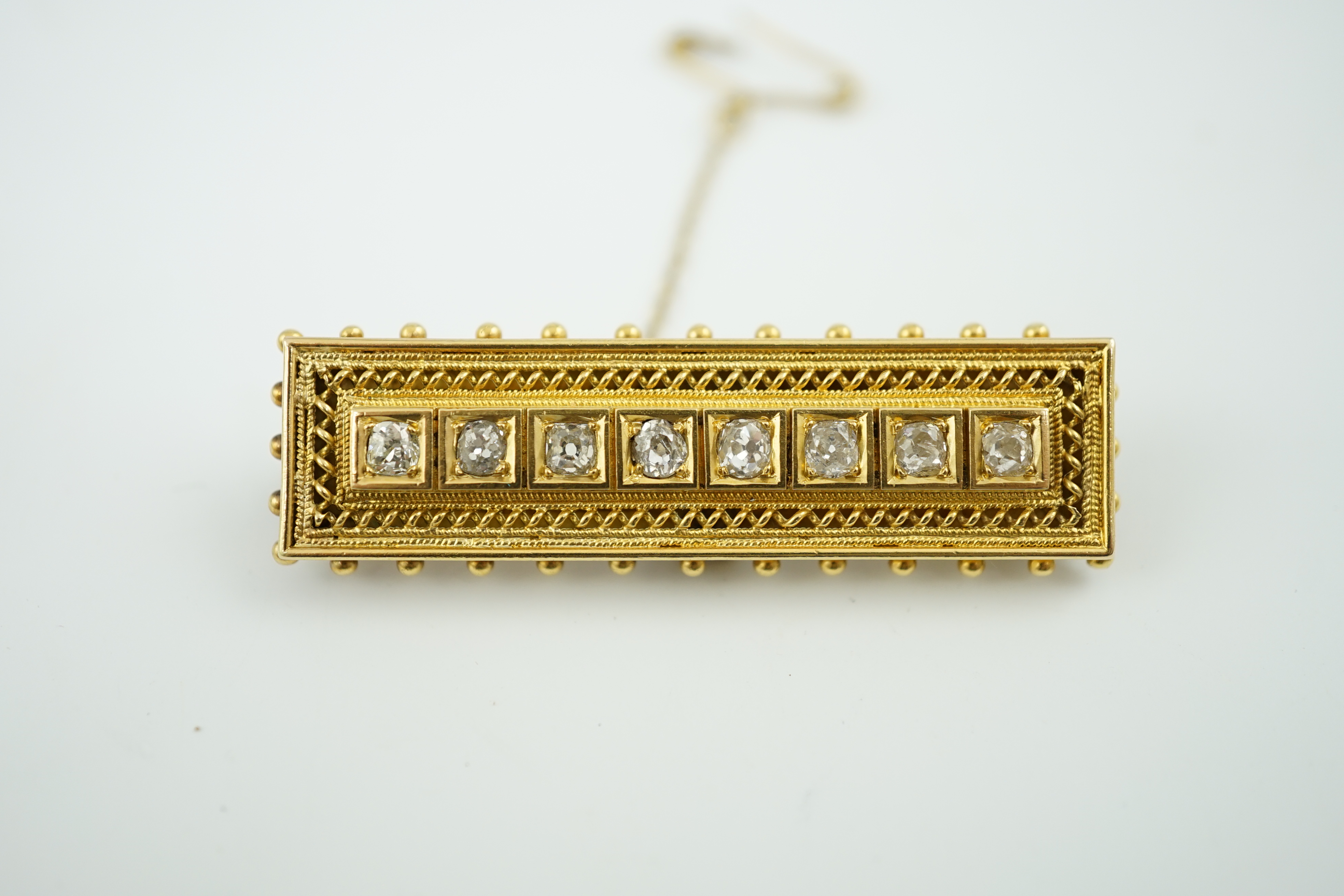 A late Victorian gold and eight stone diamond set brooch